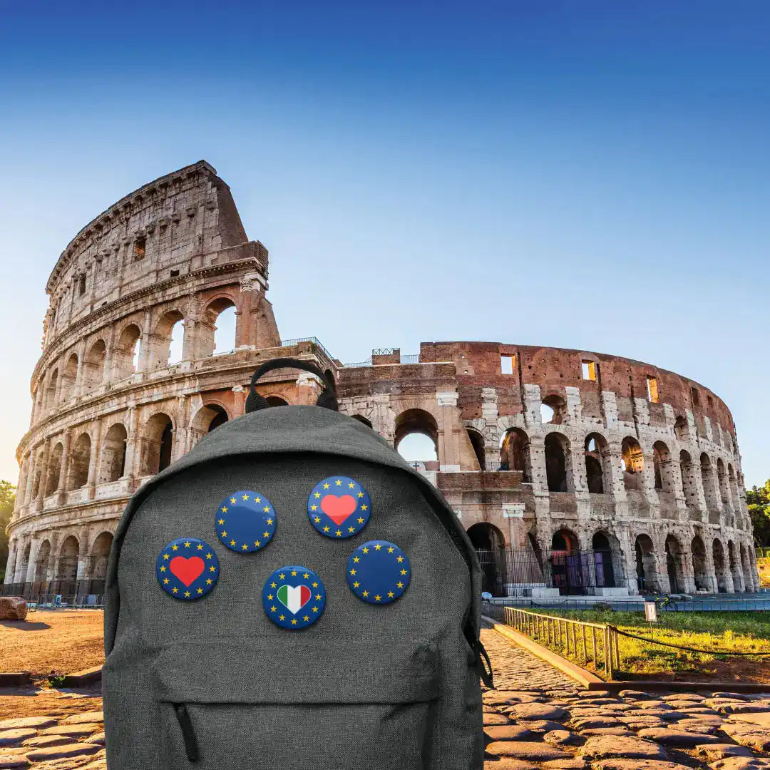 Bakpack with "Show the Love for EU" pins in front of Colosseum, Rome