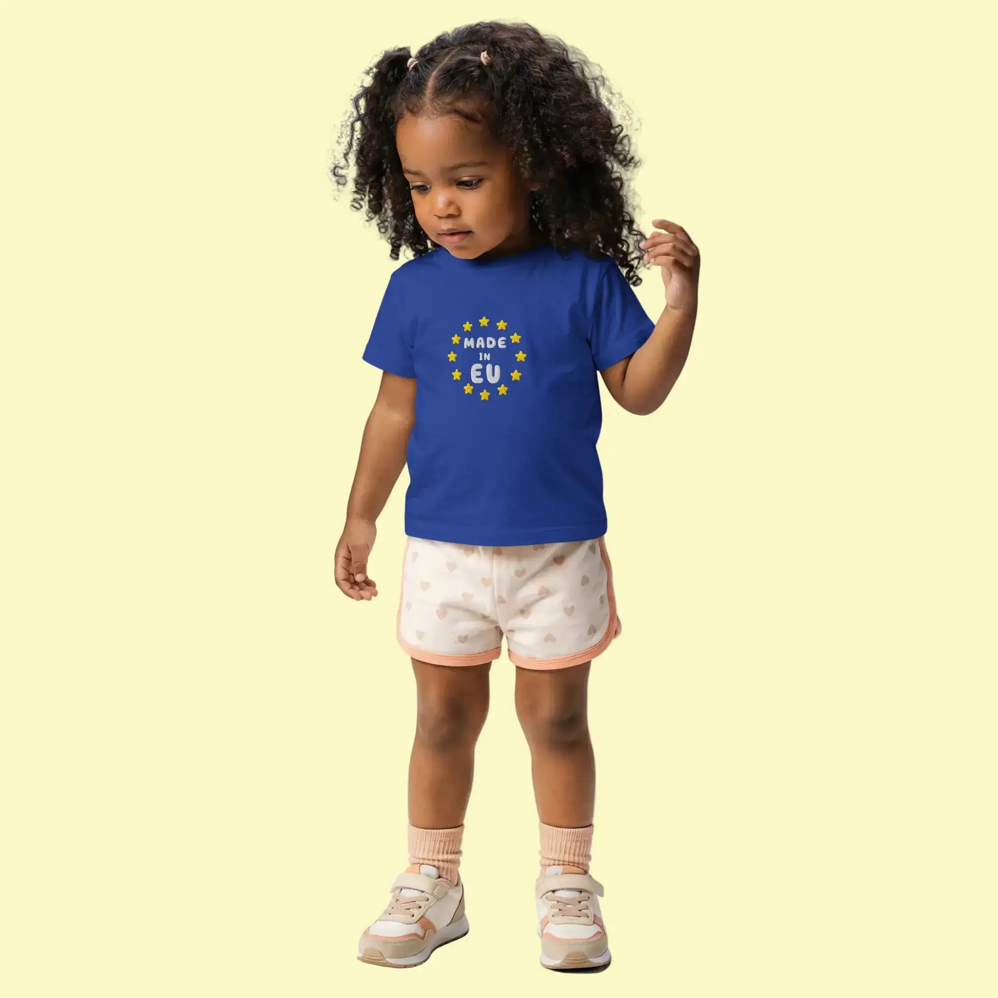 Navy Blue "Made in EU" Embroidered Baby T-shirt on a Girl Front View
